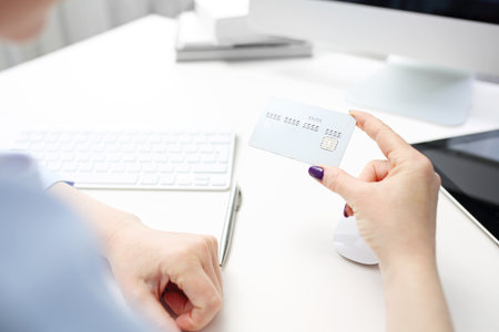 Online bank transfer. The woman pays with an online payment cardの写真素材