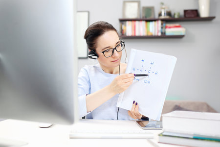School on line. The teacher conducts the lesson online.の写真素材