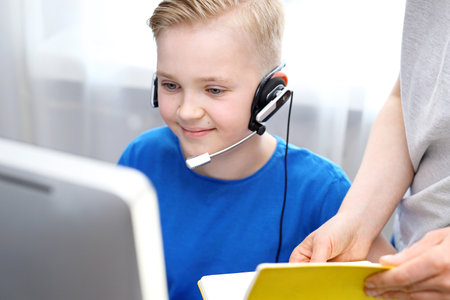 Distance learning. E-learning. The child learns via the internet, online lesson.の写真素材