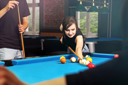 Billiard club. Billiard tournament. Billiard game. The player sets the balls on the pool table.の写真素材