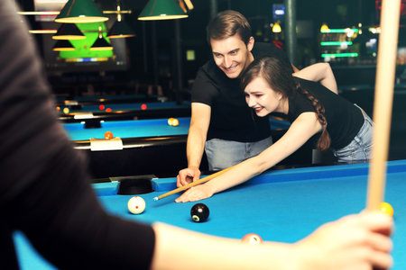 Billiard club. Billiard tournament. Billiard game. The player sets the balls on the pool table.
