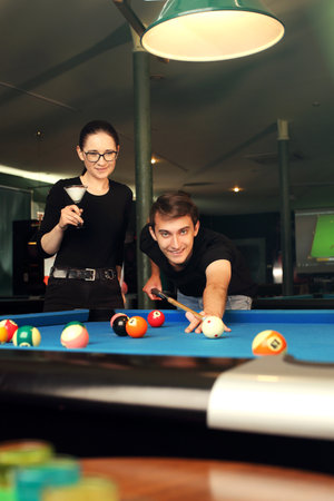 Pool game. People play billiards in a billiard club.