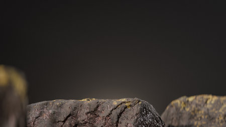 A closeup shot of a stone on a black background with copy space