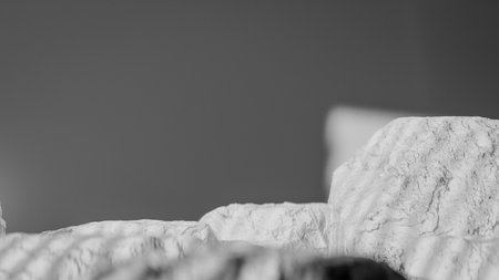 Close-up of a white pillow on a bed in the morning