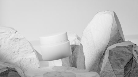 cosmetic cream in a container on a white background with stones.の写真素材