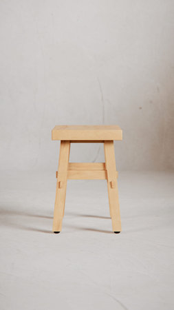 Wooden stool on a white background. Minimalism style.