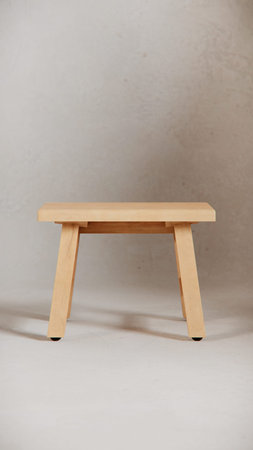 Wooden stool on a gray background. Minimalism style.