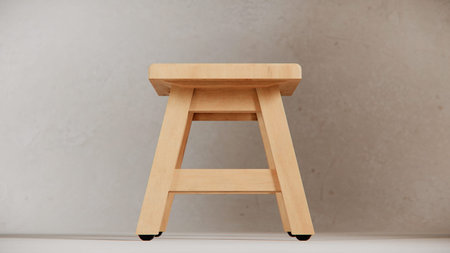 Wooden stool on the white floor in a room with concrete wall