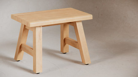 Wooden stool on gray concrete background. Furniture for the kitchen.