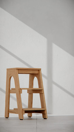 Wooden stool against white wall with shadow from window. Interior design