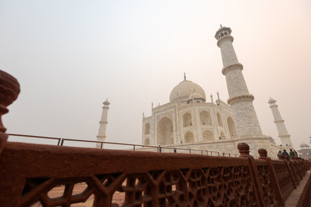 Looking up at the Taj Mahal in Agra, India, on overcast morning with smogの写真素材