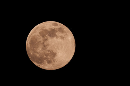 Full frame shot of full moon in pitch black sky