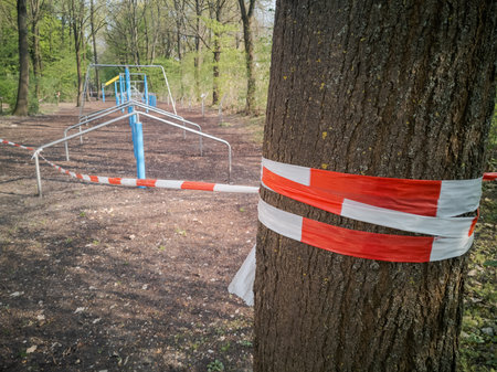 Outdoor workout trainings grounds blocked with barrier tape during Corona pandemic lockdown on Easter Monday 2020 in Regensburg, Bavaria, Germanyの写真素材
