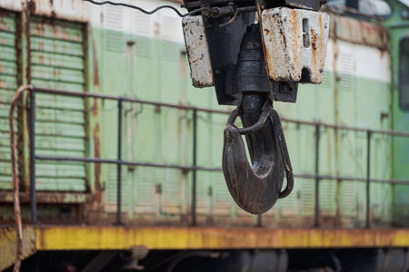 Big metal hook of crane waggon with blurred diesel locomotive in background in Pripyat, Chernobyl Exclusion Zoneの写真素材