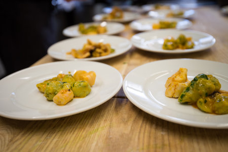 Homemade gnocchi with ramson on small plates as starter dish