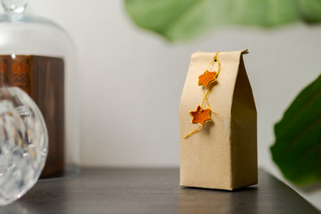 Selfmade gift box out of old beverage carton decorated with star shaped cut out dried roange peel...