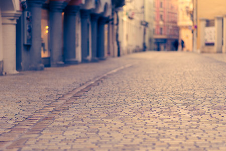 Deserted GesandersstraÃe in Regensburg pedestrian zone on beautiful morning with sunshineの写真素材
