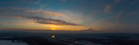 Aerial drone panorama of Regensburg in Bavaria with snow during sunrise on clear cold winter dayの写真素材