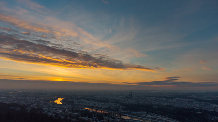 Aerial drone view of Regensburg in Bavaria with snow during sunrise on clear cold winter dayの写真素材