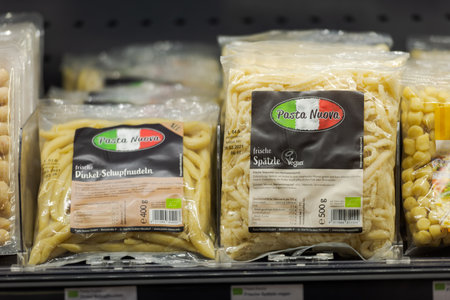 Regensburg, Germany - 2021 02 05: Refrigerated section with packaged various fresh German pasta specialties of brand Pasta Nuova behind glass doors on display in organic super marketのeditorial素材