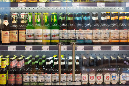 Regensburg, Germany - 2021 02 05: Refrigerated section with bottles of various German craft beer brands behind glass doors on display in organic super marketのeditorial素材