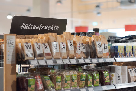 Regensburg, Germany - 2021 02 05: Sign over aisle in german organic supermarket with german word for legumesのeditorial素材