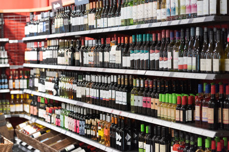 Regensburg, Germany - 2021 02 05: Wine rack with variety of different organic wine bottles in German organic super marketのeditorial素材