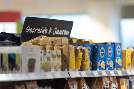 Regensburg, Germany - 2021 02 05: Sign over aisle in german organic supermarket with german word for cereals and seedsのeditorial素材