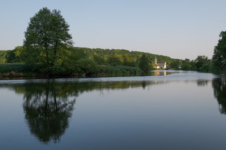 The church St. BartholomÃ¤us of the village Zeitlarn near Regensburg, Bavaria on the river Regen in afternoon sunlightの写真素材