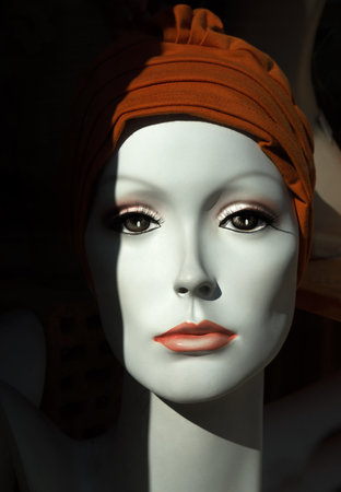 Noble face of a female mannequin with a brown headgearの写真素材