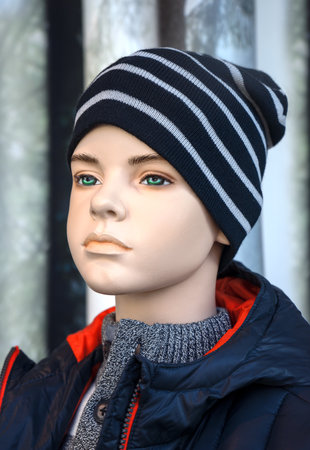 Mannequin - Boy with conspicuous eyebrows and green eyes wears sweater, anorak and beanie.の写真素材