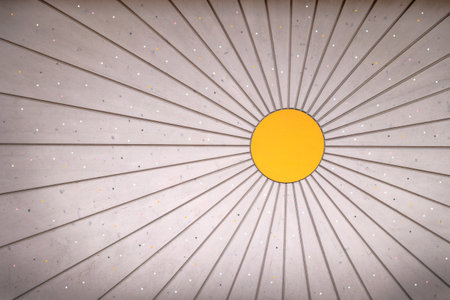 Sun-shaped, bright, slightly dirty wooden wall with small light colored points and vignettingの写真素材