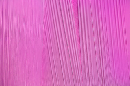 Pattern of a pink foil with taut, slightly corrugated surfaceの写真素材