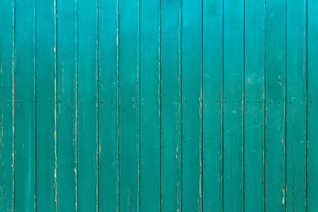 Slightly weathered, turquoise wooden wallの写真素材