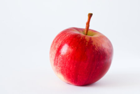 Red apple on white の写真素材