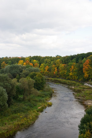 Small river from high view point with colorful trees on banks