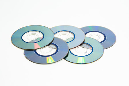 Stock of compact discs on white in form of sports competition rings