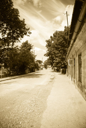 Old small street in old town. Sepiaの写真素材