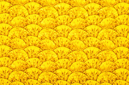 Yellow textile with patterns in form of hills or waves