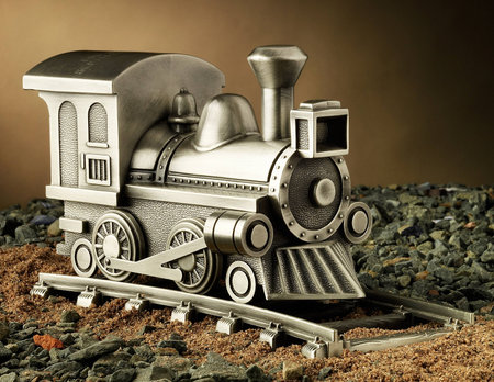 Pewter Model Train on Tracks
