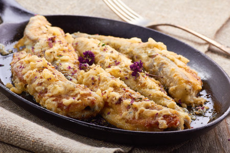 Pan-fried fish in cream souce with onion, oregano and thymeの写真素材