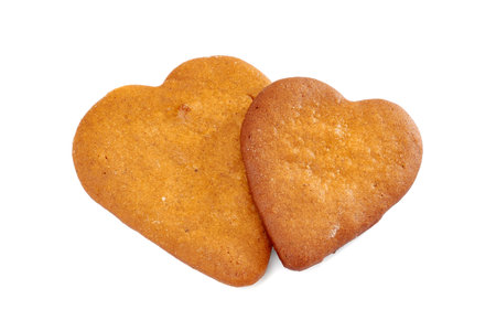 Two heart shaped gingerbread cookies on whiteの写真素材