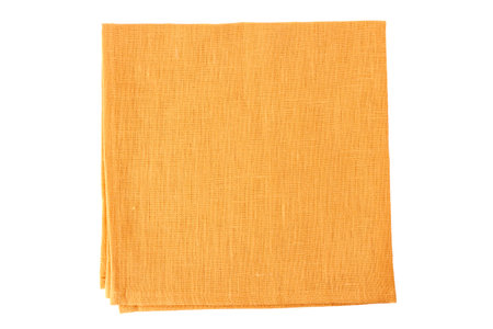 Pale orange textile napkin on whiteの写真素材