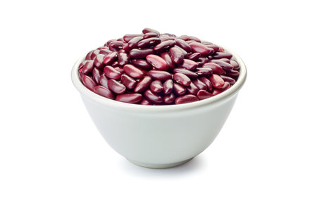Bowl of raw red beans on whiteの写真素材