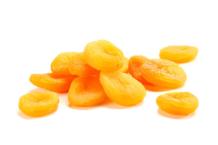 Heap of dried apricots on whiteの写真素材