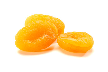 Three dried apricots on whiteの写真素材