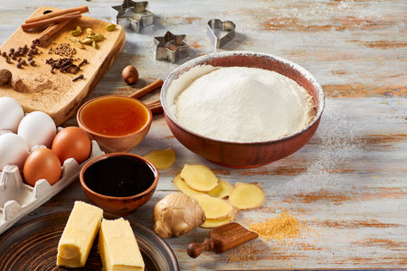 Ingredients of gingerbread recipe on wooden table