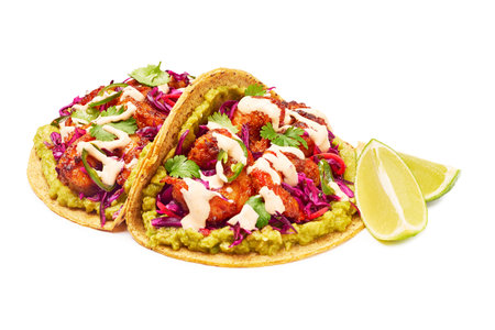 Mexican tacos with shrimp,guacamole and vegetables isolated on whiteの写真素材