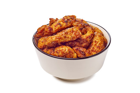 Enjoy a delightful serving of Delicious Crispy Chicken Wings beautifully presented in a Bowlの写真素材