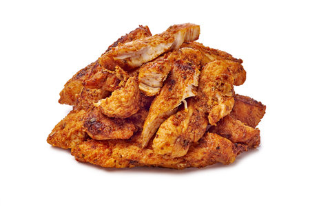 Savor the experience of deliciously crispy fried chicken pieces piled high on your plateの写真素材